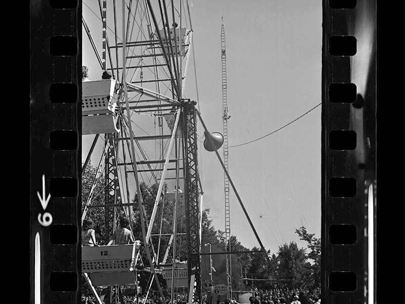 Riders on the Ferris Wheel watch a high diver during the Tribune's Old Fashioned 4th celebration, 1962. Photo: Salt Lake Tribune
