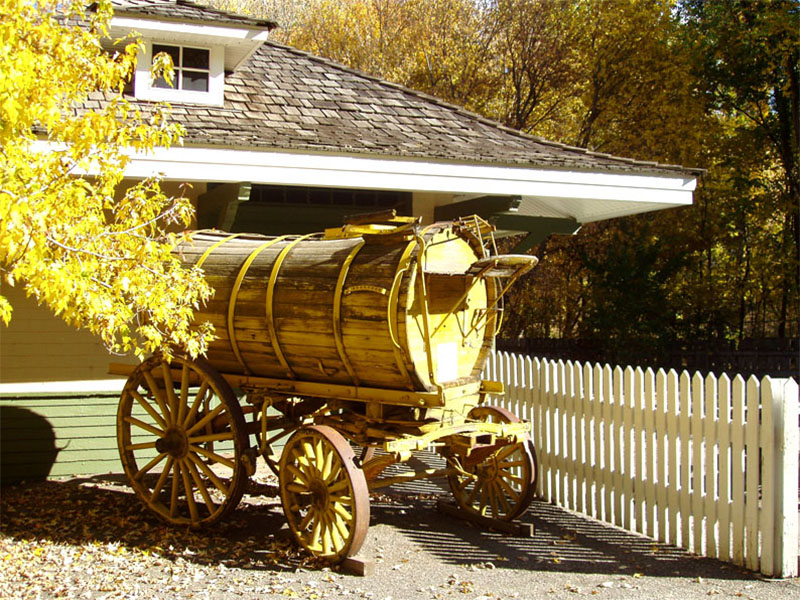 Studebaker street sprinkler wagon in front of the large freight room door. Photo: B. Miskin