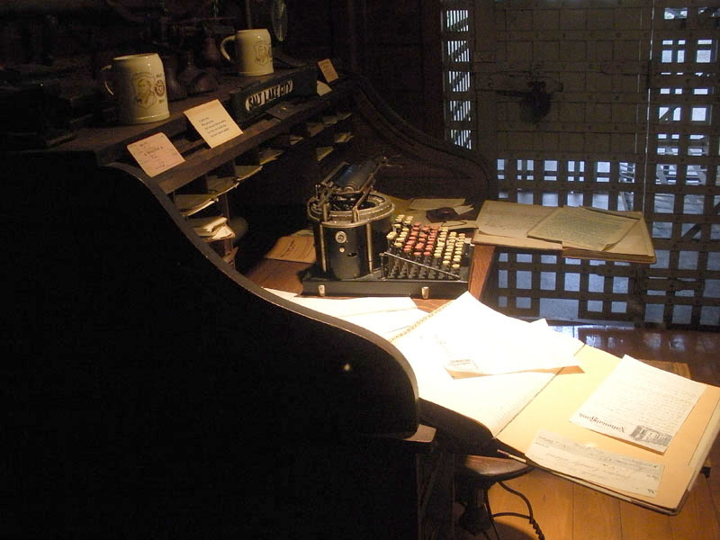Roll-top desk with an antique typewriter in the back by the jail cells. Photo: B. Miskin