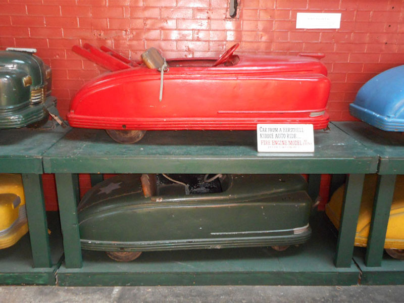 Fire truck vehicle above a roadster vehicle at the Allan Herschell museum in New York. Photo: B. Miskin
