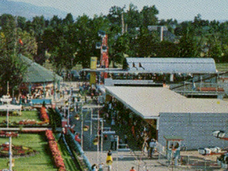 Rock-O-Plane in its first location, south of Roller Coaster, as shown in a 1954 postcard.