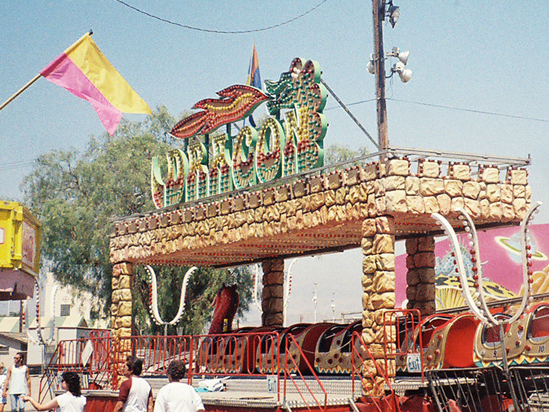 Zamperla Dragon coaster at a fair in California in 1990. The sign is similar to the one added to Lagoon's Colossus in 1984. Photo: John Toomey
