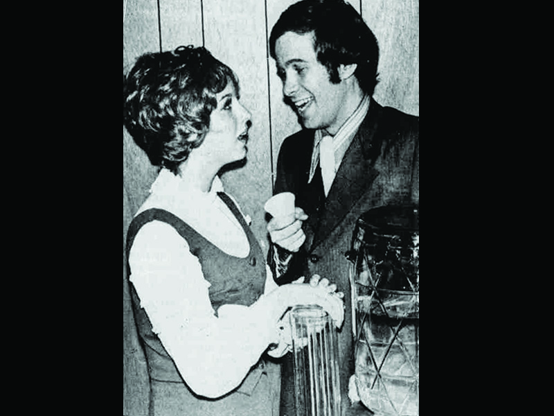 Tracie Pastore & Dan Handley in a promotional photo for "How To Succeed In Business Without Really Trying". Printed in Orem-Geneva Times.