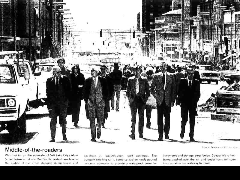 Businessmen walk down the streets of downtown Salt Lake while the sidewalks are under repair. Photo: Deseret News