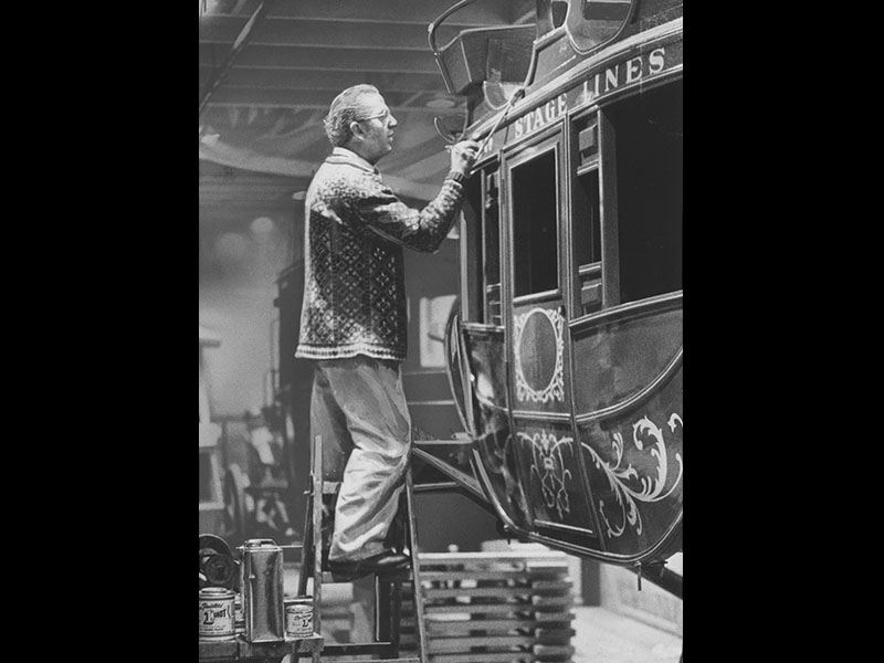 Henning Anderson puts finishing touches on Lagoon's stagecoach in March 1976. Photo courtesy of Deseret News