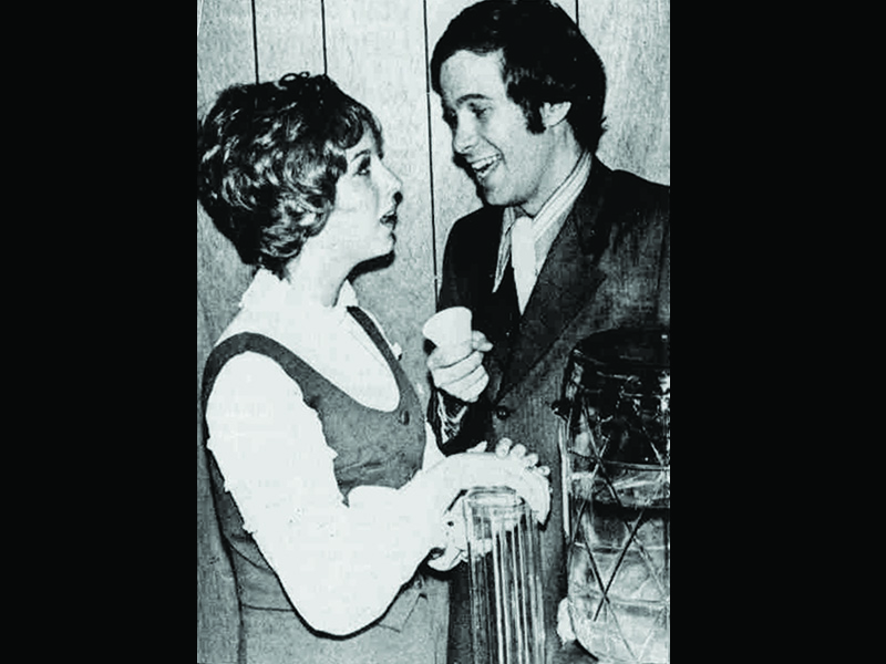 Tracie Pastore & Dan Handley in a promotional photo for "How To Succeed In Business Without Really Trying". Printed in Orem-Geneva Times.