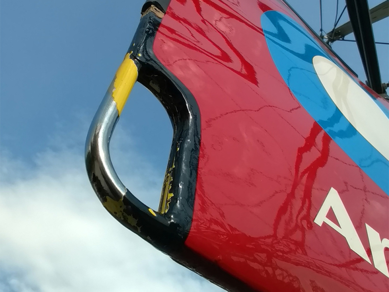 Close up of the rudder on the Avro 504 plane, showing the pre-existing yellow paint scheme.